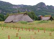 bronze age and thatched roof with outlines of other buildings