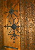 ornate carved door frame and iron door decoration